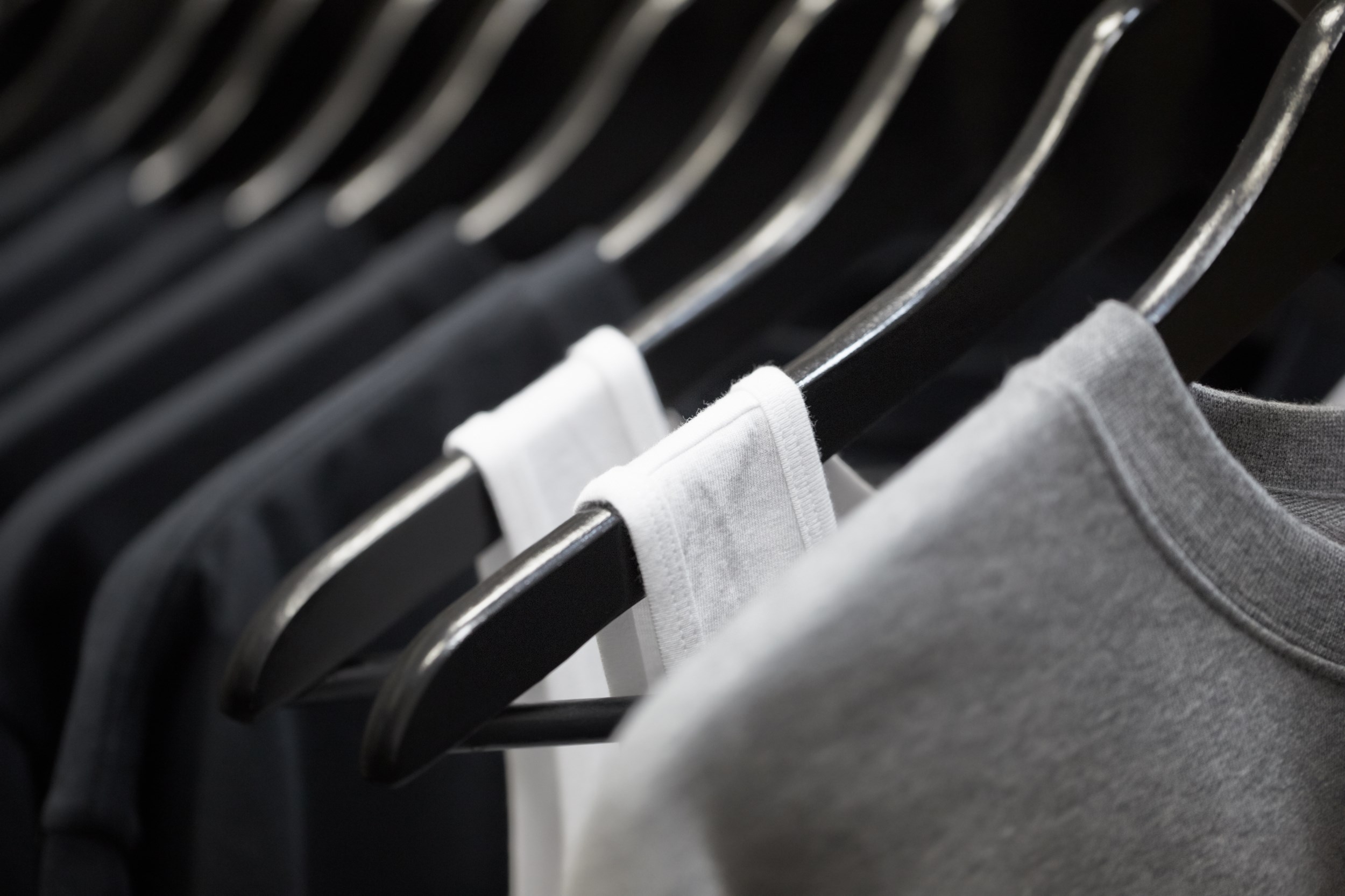 sports clothing on hangers, abstract background
