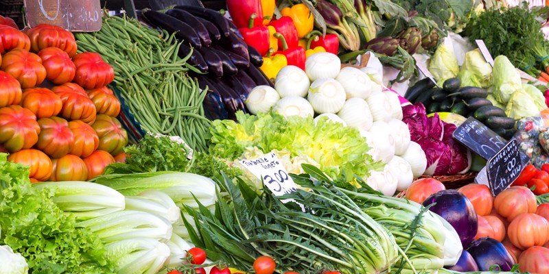 Colourful fresh fruit and vegetables stall arrangement